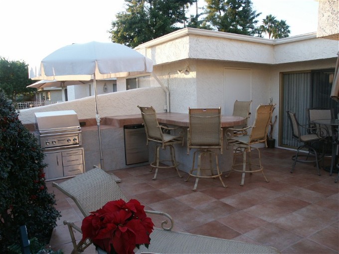 Custom BBQ Island Installation of Outdoor Kitchen and Dining Area